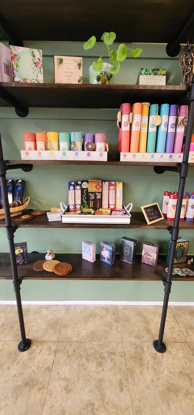 A display shelf of incense, cards and small gifts