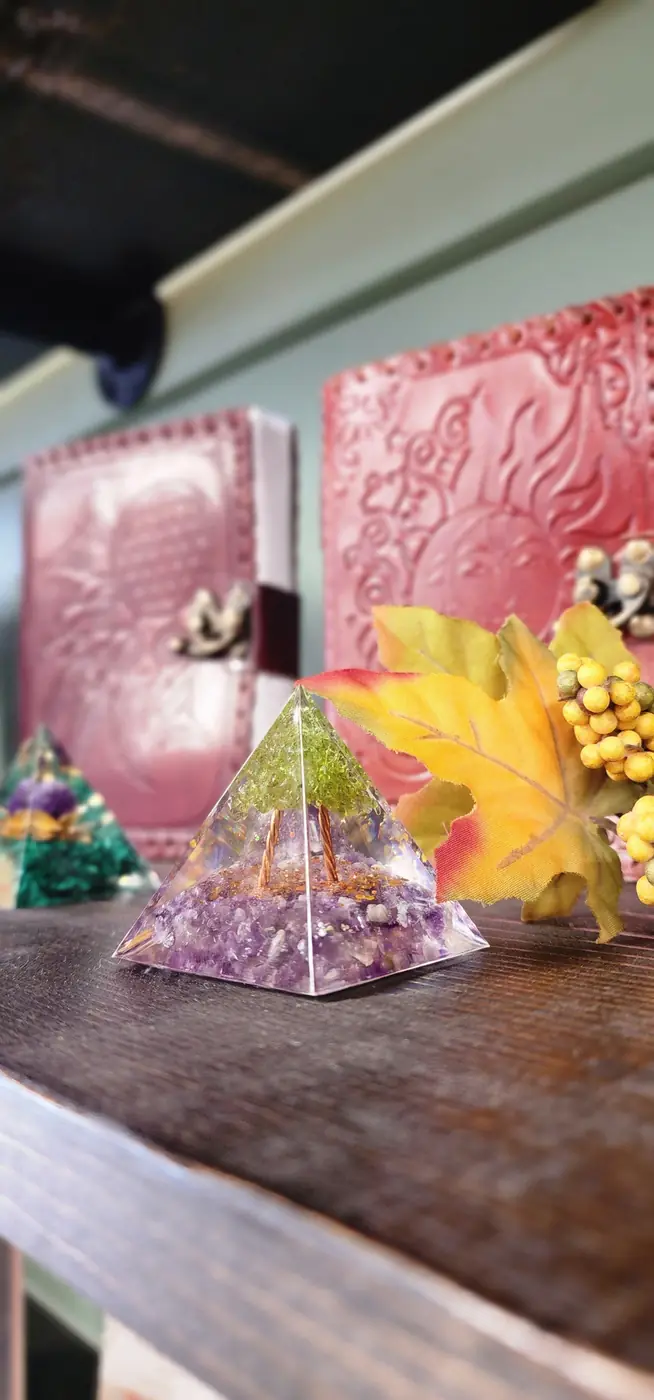 Embossed journals and an orgonite pyramid