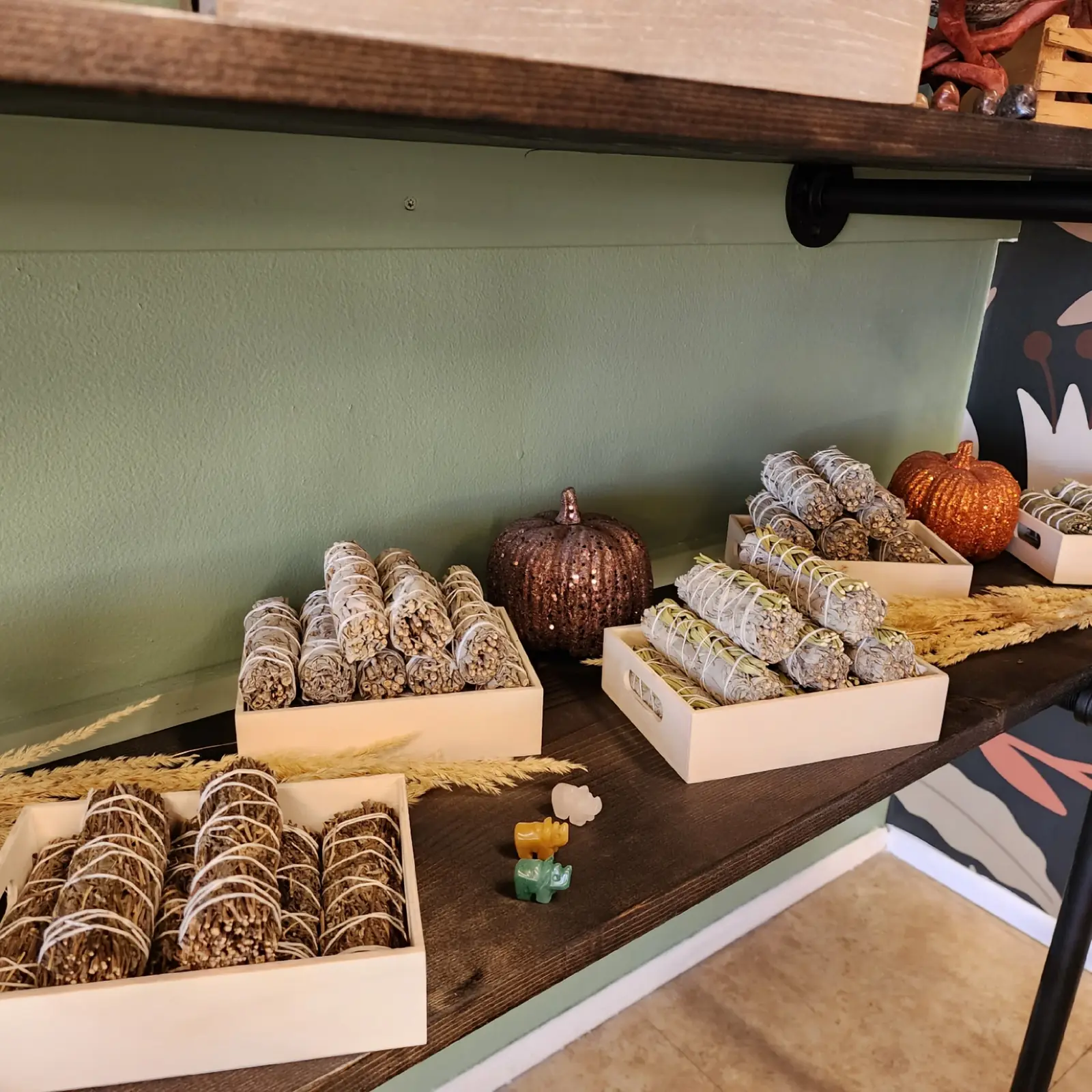 A display of smudge sticks and cleansing supplies